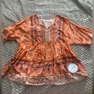 Orange print flowy blouse